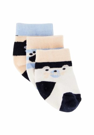 Tre paia di calzini per neonati con facce di animali nei colori bianco, blu, nero e beige impilati su uno sfondo bianco.