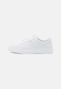 White leather sneakers with smooth texture, rounded toe, and tonal stitching. Features blue laces and a gold logo on the side.