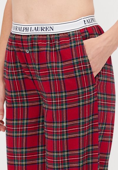 Piros és zöld kockás pizsama nadrág fehér elasztikus derékpánttal, rajta "RALPH LAUREN" logo, oldalsó zsebekkel és laza fazonnal.