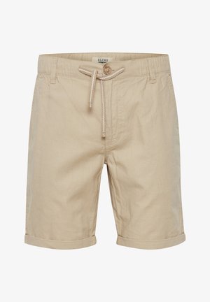 Beige bomuldsshorts med rullede manchetter, justerbar snøre i taljen, enkelt træknaplukning og subtil tekstur. Etiketten er synlig indeni taljen.