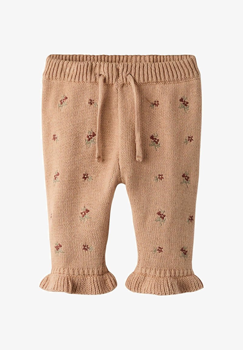 Pehmed beežid kudumpüksid punase ja rohelise lillemustriga tikandiga. Neil on soonikkoes vöökoht paelaga ning lipsukujulised ääred.