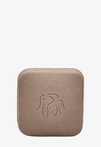 Brown square soap with rounded edges, featuring a raised elephant design on the front. Made from natural materials, textured surface.