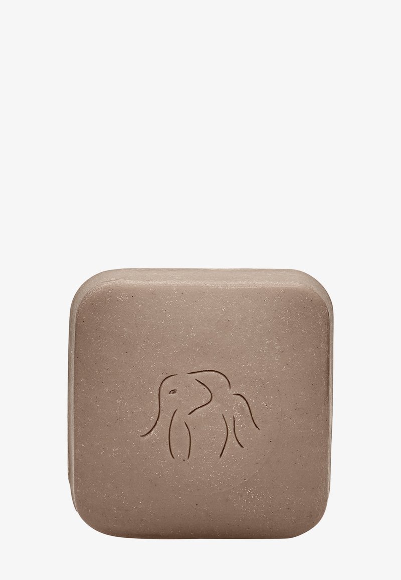 Brown square soap with rounded edges, featuring a raised elephant design on the front. Made from natural materials, textured surface.