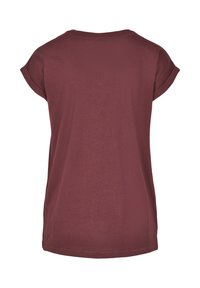 T-shirt bordeaux a maniche corte, coltondo, in morbido cotone, vestibilità rilassata, cuciture pulite, senza grafiche o decorazioni.