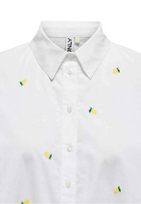 White shirt with a classic collar, featuring yellow lemon embroidery and green leaves, finished with buttons down the front.
