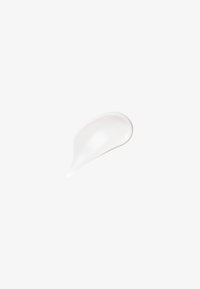 White moisturizing cream smear with smooth texture on a plain light gray background.