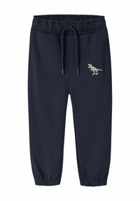 Granatowe spodnie dresowe z elastycznym paskiem w talii i regulowanym sznurkiem, ozdobione jasnym haftem dinozaura z przodu.