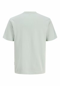 T-shirt en coton à manches courtes gris clair uni, vu de dos avec col rond et sans logos ni motifs visibles.