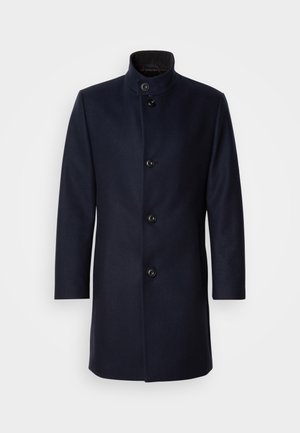 Marineblauer Wollmantel mit hohem Kragen, fünf vorderen Knöpfen, seitlichen Taschen und einem eleganten, geraden Schnitt. Glatte Textur, ohne Muster.