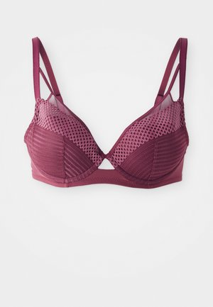 Mauve bra with a structured design, featuring mesh detailing, multiple textures, and open sections at the center and sides.