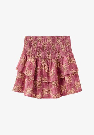 Pink tiered skirt with elastic smocked waistband featuring beige palm tree pattern and ruffled layers.