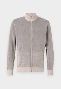 Zip-up cardigan i struktureret strikstof med høj krave, lange ærmer og et stribet mønster i beige og marineblå.