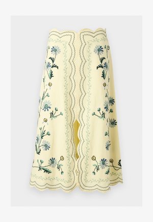 Κίτρινη φούστα μέχρι το γόνατο με κυματιστές άκρες και κεντήματα με λουλούδια σε μπλε, πράσινο και κίτρινο, με κεντρική σχισμή και διακοσμητικές ραφές.