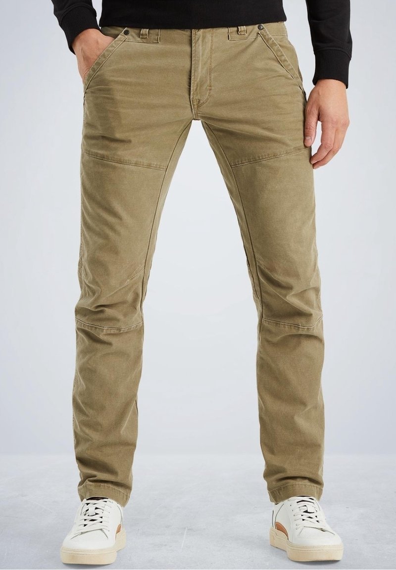 Khaki cotton pants with a slim fit, featuring angled front pockets and knee panels. Paired with white sneakers. Smooth texture, casual design.