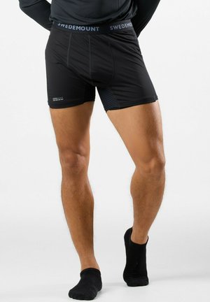 Black athletic boxer shorts with a smooth texture, featuring a wide elastic waistband labeled "SWEDEMOUNT" and side panel detailing.