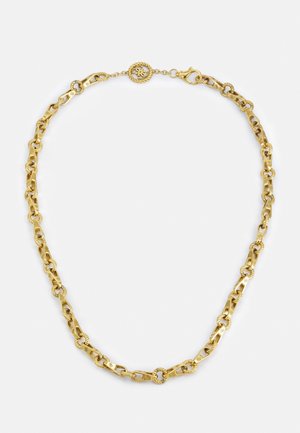 Gold chain necklace with textured round links and a decorative circular clasp featuring a small flower design.