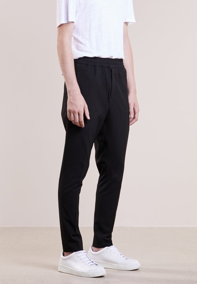 EDDIE - Trousers - black