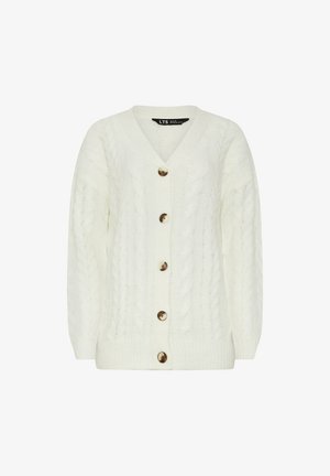Hvid kabelstrikket cardigan med V-hals, lange ærmer, fem store gyldne knapper og ribbede manchetter og kant. Blød tekstur og afslappet pasform.