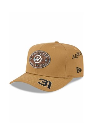 Brown cap with a structured design, featuring an embroidered logo patch and numeric accent "31" in black. Also has side text details.