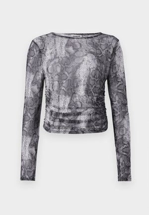 Pikem varrukatega tipp must-valges sisalikumustris, millel on kokku rikutud külgdetail ja kerge, tekstuuriga kangas.