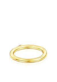 Goldfarbener Metallarmreif mit einem glatten, runden Design. Verfügt über einen kleinen blauen Akzent in der Nähe der Öffnung, der eine polierte Oberfläche zeigt.