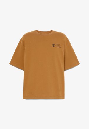 Brown short-sleeve T-shirt with small Timberland logo and text on left chest reading "If your feet ever get cold or wet you haven't set foot in Timberland footwear."