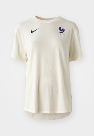 Valkoiseksi värjätty Nike-t-paita lyhyillä hihoilla, jossa on vasemmassa rinnassa sininen kukko-logo ja 'FFF'-symboli. Sujuva kangas.