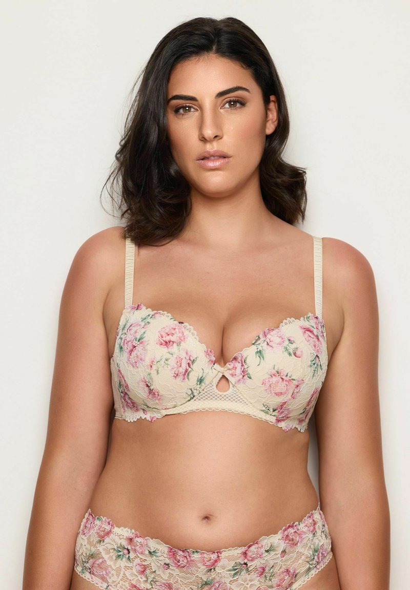 Beige bloemenkant beha met roze rozenpatronen en geschulpte randen. Inclusief een decoratieve sleutelgat en bijpassende bloemenkant slip.