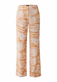 Pantalon léger en lin aux tons pêche doux et crème, arborant un motif rayé tigre, une coupe droite et une taille mi-haute.
