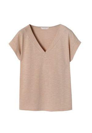 T-shirt beige clair à encolure en V avec des manches courtes et retroussées. Fabriqué en matériau doux et texturé, avec une coupe décontractée et un ourlet droit.