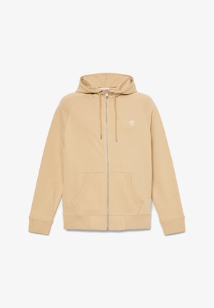 Beżowa bluza z kapturem na pełny zamek, z przednimi kieszeniami, kapturem ze ściągaczem, ściągaczami przy mankietach oraz małym białym logo drzewa na lewej piersi.