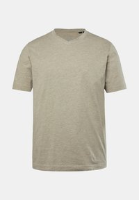 Camiseta de manga corta con escote en V en color beige claro, hecha de un tejido suave y texturizado. Presenta un corte relajado y un sutil logo de la marca en el frente.