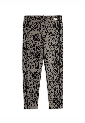 Girl's slim-fit leggings with black leopard print on gray fabric, medium size tag on waistband.