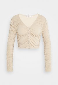 Beige zkrácený top s dlouhým rukávem a výstřihem do V, zdobený nařasenou texturou a dekorativními knoflíky vpředu. Měkká, elastická látka.