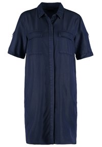 Robe chemise bleu foncé à manches courtes, col, fermeture boutonnée devant et deux poches poitrine avec rabats.