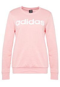 Felpa rosa realizzata in tessuto morbido, con maniche lunghe e scollatura rotonda. Logo "adidas" ben visibile in bianco sul petto.