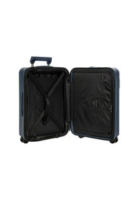 Valigia rigida di colore blu navy con interno nero. Presenta cinghie X, una tasca con zip e ruote lisce per un facile trasporto.