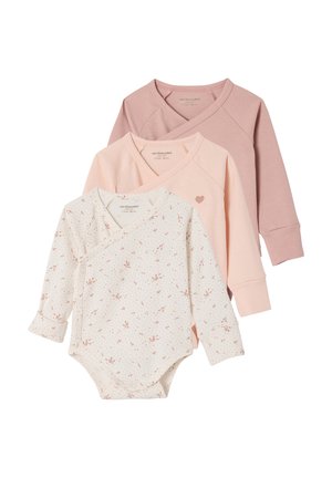 Three long-sleeve baby bodysuits with crossover necks, in white floral print, solid pale pink with heart, and muted mauve colors.