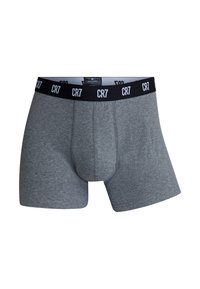 Gray boxer shorts with a black waistband featuring white "CR7" branding. Soft stretch fabric, low-rise design, and fitted shape.