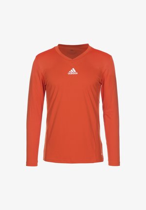 Long-sleeve, V-neck, athletic shirt in bright orange fabric. Features a white Adidas logo on the chest. Smooth texture with slight sheen.