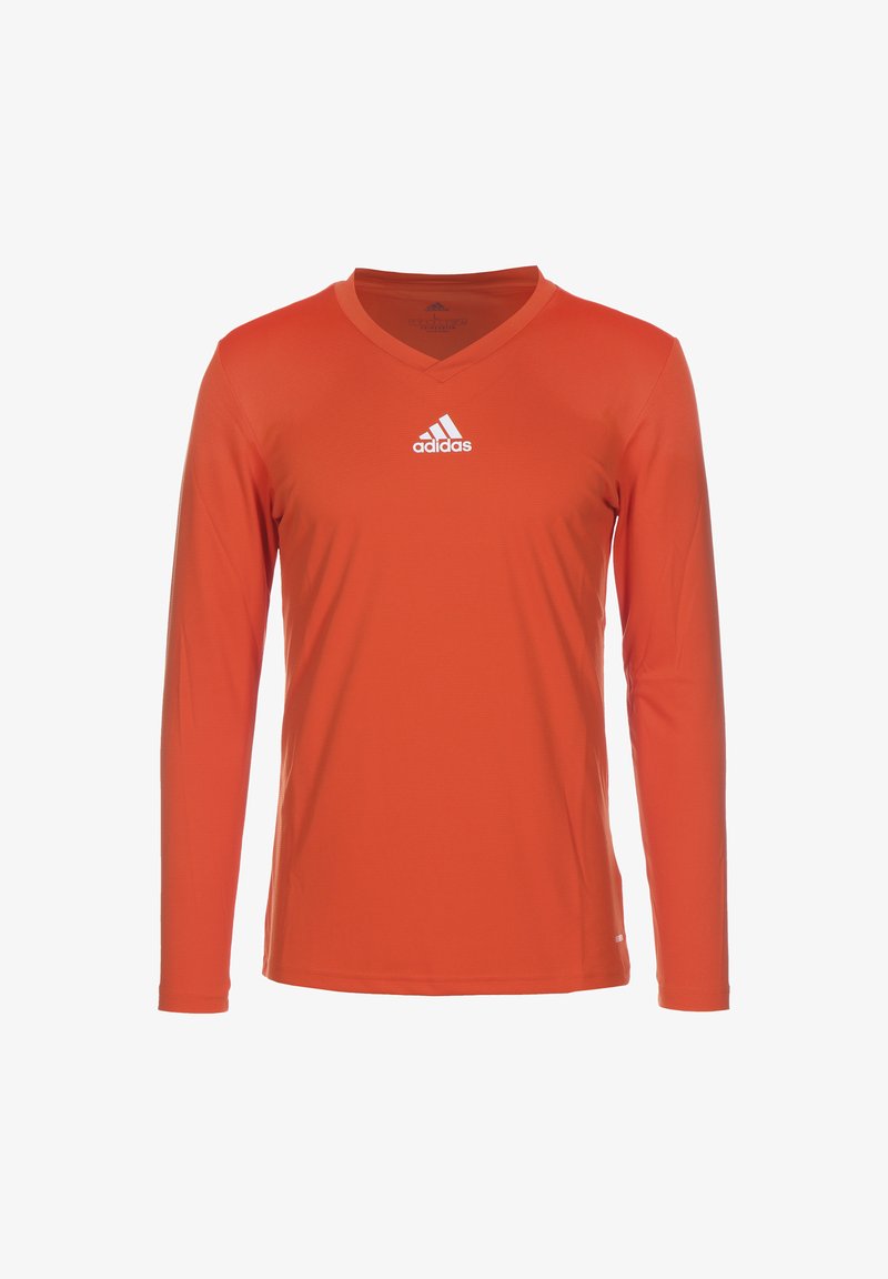 Long-sleeve, V-neck, athletic shirt in bright orange fabric. Features a white Adidas logo on the chest. Smooth texture with slight sheen.