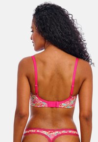 Floral-patterned bra in pink with adjustable straps, hook closure, and a matching pink lace thong, featuring a smooth texture.