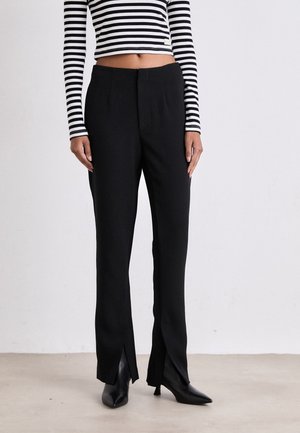 Pantalones - black
