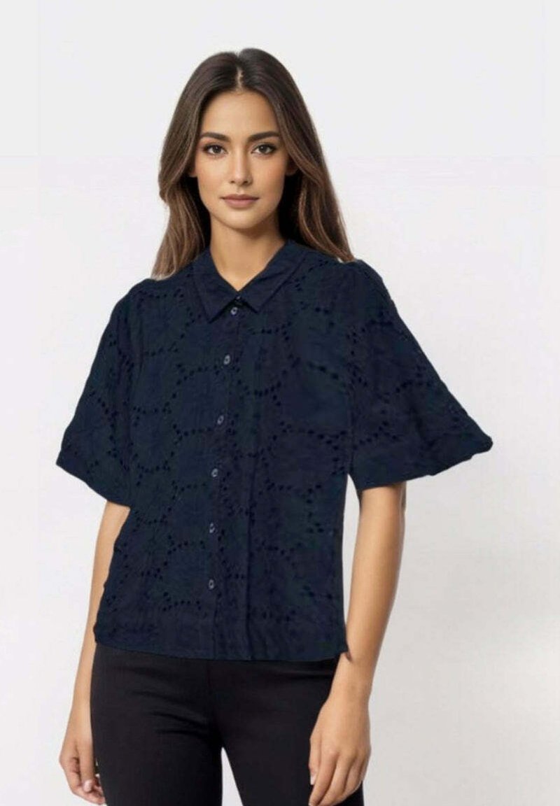 Navy blue short-sleeve shirt with a button-up design, featuring eyelet patterns and a classic collar. Soft, textured fabric.