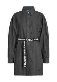 Ciemnoniebieska sukienka koszulowa z kołnierzykiem, zapięciem na guziki i długimi bufiastymi rękawami. Posiada markowy pasek z srebrnym pierścieniem.