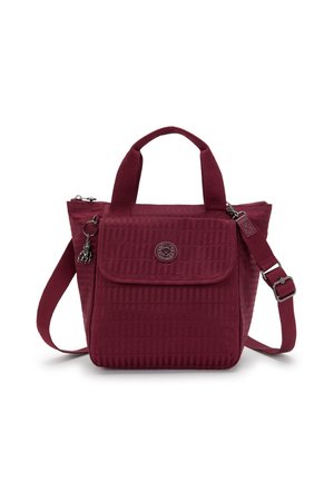 Maroon tote bag with textured fabric, dual top handles, and a detachable shoulder strap. Features a flap and embossed logo detail.