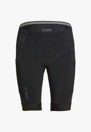 Schwarze Vaude-Radhose mit gepolstertem Sitz, Netzbund und reflektierenden Markenlogos am linken Oberschenkel und an der rechten Seite.