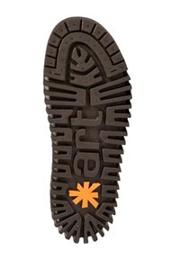 Suela de zapato de goma con ranuras y relieves profundos, principalmente marrón con un logotipo de estrella naranja en el centro, que ofrece tracción y estabilidad.