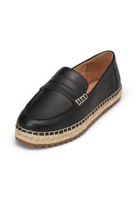 Black leather slip-on shoe featuring a woven jute outsole, embossed accents, and decorative stitching along the edge.