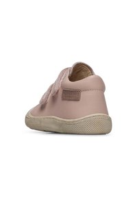 Pink leather shoe with a textured feel, features a velcro strap, rounded toe, and a rubber sole with a patterned grip.